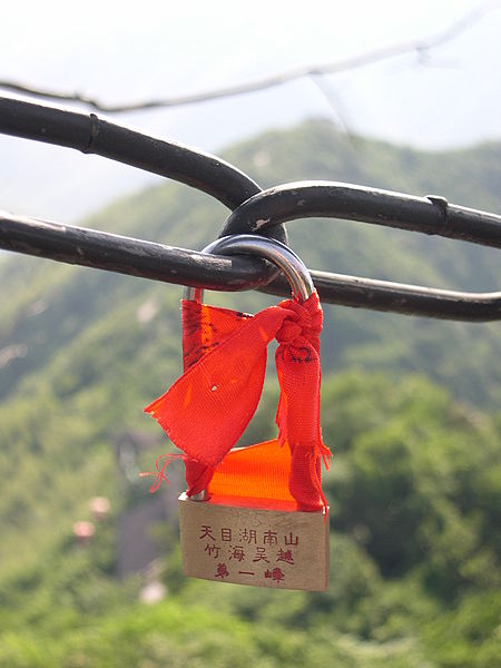 On the mountain top, a small shop sells these locks. Lovers write their name on it and look it on the fence. (Original PIcture Caption from Source: Wikipedia Commons )